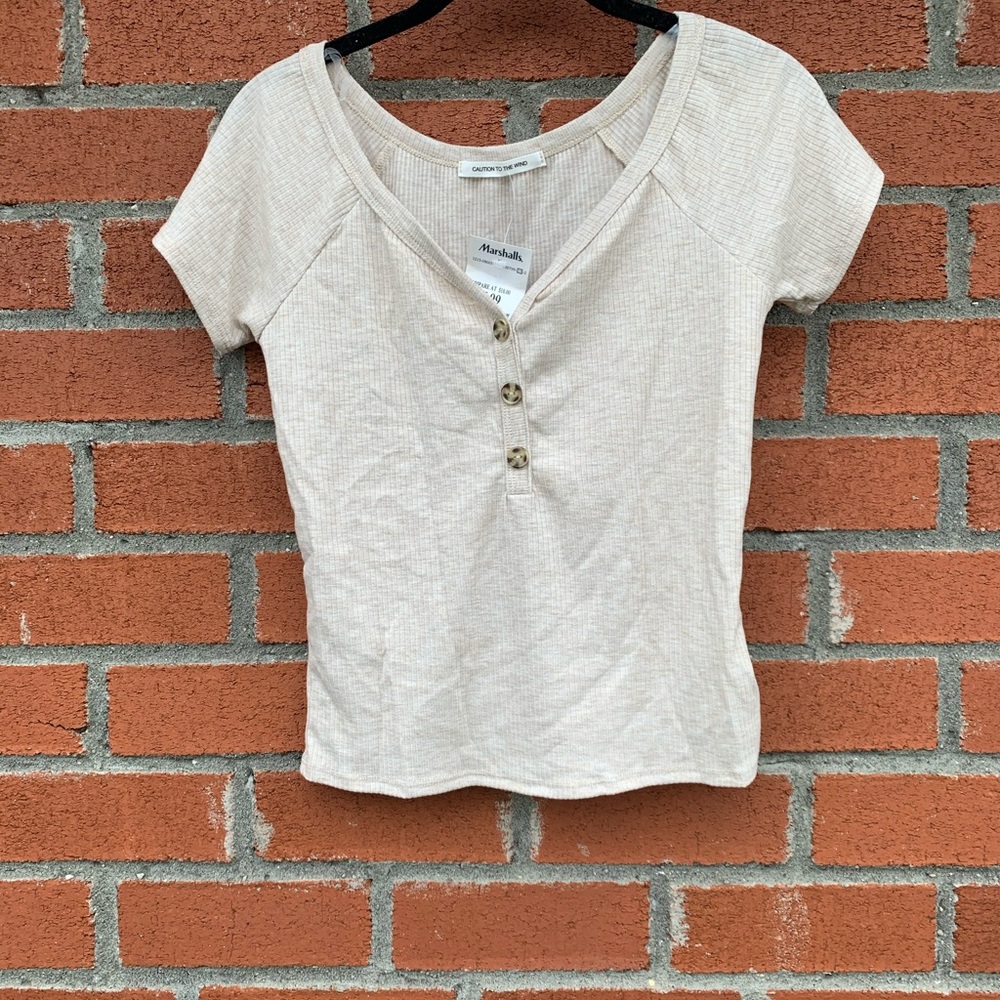 Cream colored crop T-shirt with brown buttons